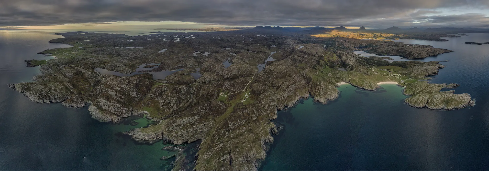 Aerial view of the Assynt coastline, its islands and inlets, at dusk